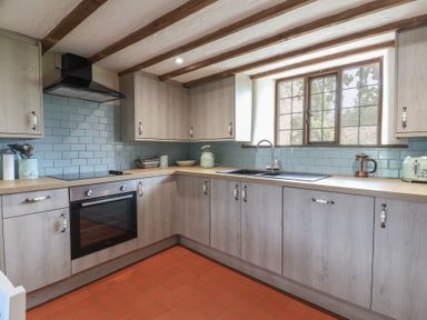 A kitchen with a sink and oven at Garden View in Wellington