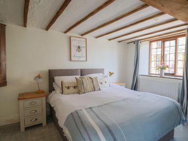 A bedroom with a bed and a window at Garden View in Wellington