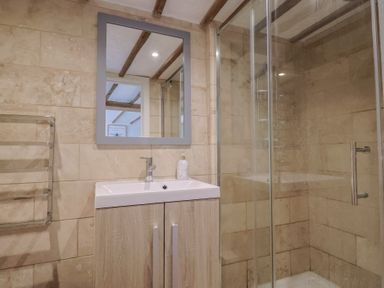 A bathroom with a shower and sink at Garden View in Wellington
