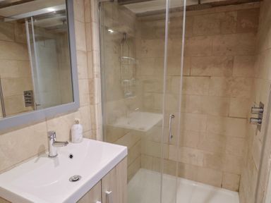 A bathroom with a shower and sink at Garden View in Wellington