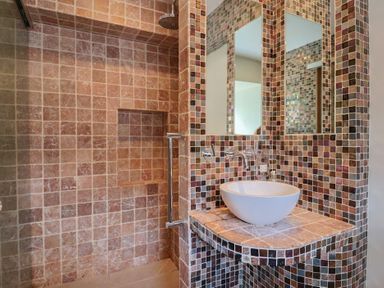 A bathroom featuring a shower and a sink at Garden View in Wellington