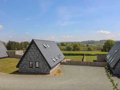 Stone houses with slate roofs and fenced yards with countryside views at Hill Radnor - The Sheepfold in Llanyre near Llandrindod Wells