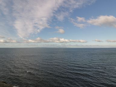 A large body of water under a partly cloudy sky at Ardlochan Lodge - Culzean Castle in Maybole