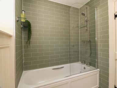 A bathroom with a bathtub and shower setup at Ardlochan Lodge - Culzean Castle, Maybole