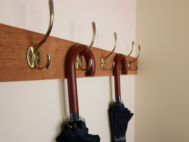 A coat rack with umbrellas hanging at Ardlochan Lodge - Culzean Castle in Maybole