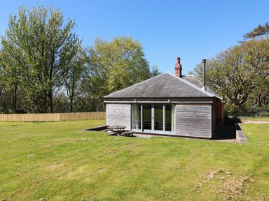 A house with large windows and a lawn at Ardlochan Lodge - Culzean Castle Maybole