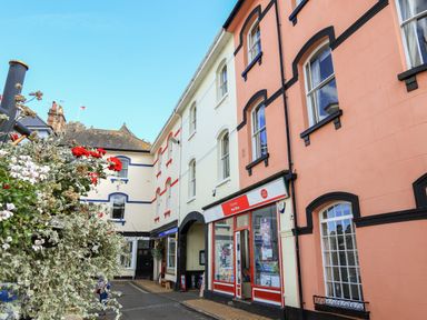A street view with colorful buildings and a post office at Ferrystone in Kingswear near Dartmouth