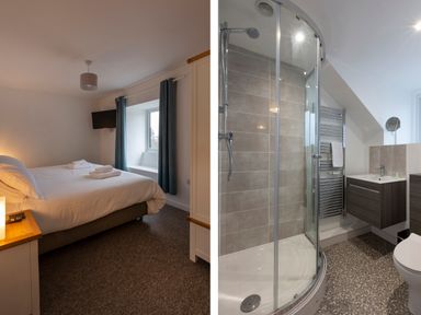 A bedroom with a double bed and a wall-mounted TV next to a bathroom with a corner shower and a sink at Rose Cottage in St Ives