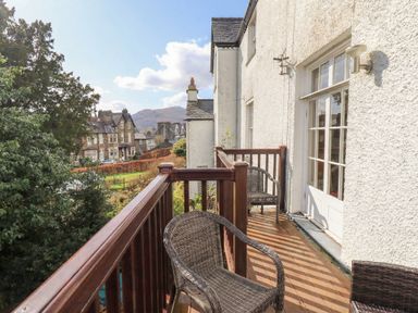 A balcony with chairs and a view at Red Screes in Ambleside
