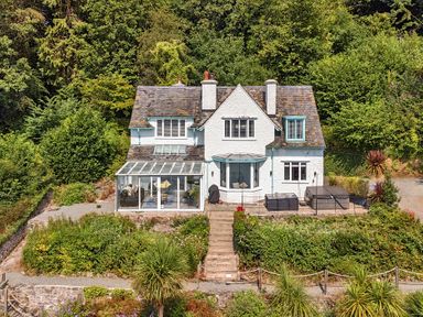A house with a garden and patio at Afallon in Menai Bridge