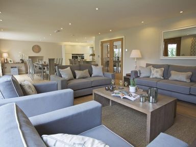 A living room with sofas and a wooden coffee table at 3 The Drive Hillfield Village in Dartmouth