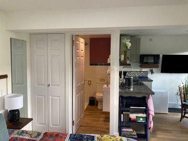 A studio apartment with a bathroom and kitchen area at The Sett on the Wharfe, Skipton