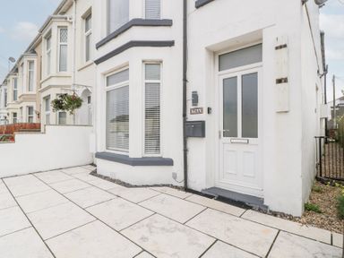 A front entrance with a door and mailbox at 76A Mackworth Road Porthcawl