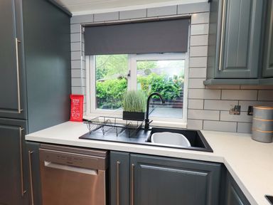 A kitchen with a sink and a window at Rydal Lodge Grasmere 24, White Cross Bay near Windermere