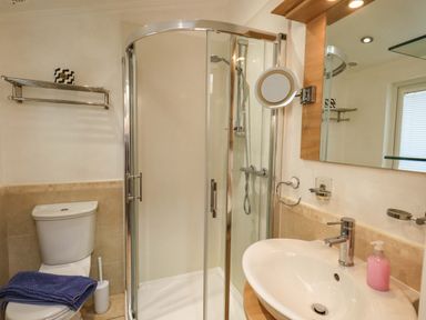 A bathroom with a shower, toilet, and sink at Elder Lodge, Kirkstone 5, Limefitt Park near Windermere