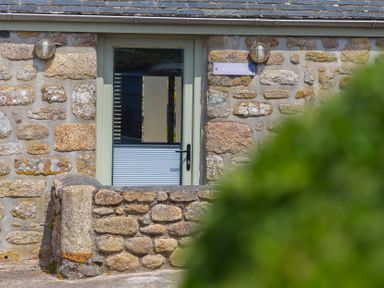 A door on a stone building at Scilly Stack in Penzance