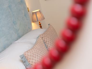A bedroom with a bed and pillows at Scilly Stack in Penzance