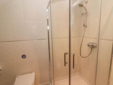 A bathroom with a shower enclosure and a toilet at Sea View in Newport Pembrokeshire