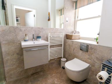 A bathroom with a sink and toilet at 4 The Beaches in Weymouth