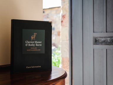 A guest information book on a table at Cheviot Manor in Wooler