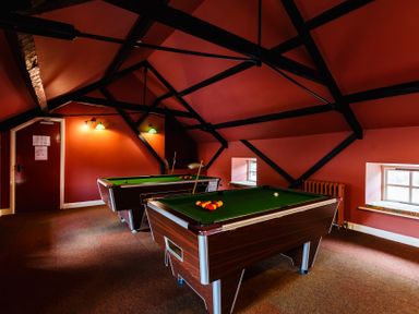 A game room with two pool tables at Catkin Cottage Akeld near Wooler