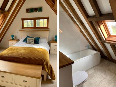 A bedroom with a bed and bedside tables next to a bathroom with a bathtub under a sloped ceiling at Bybrook Lodge in Davidstow near Camelford
