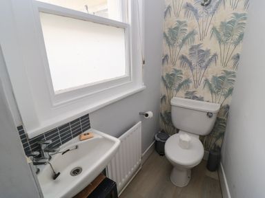 A bathroom with a sink and toilet at Still Waters in Swanage