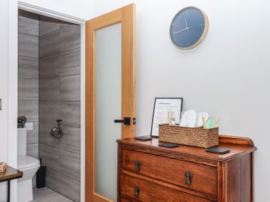 A bathroom with a toilet and sink at The Cadeleigh near Tiverton