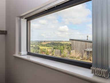 A window with a view of the countryside at The Cadeleigh Cadeleigh near Tiverton