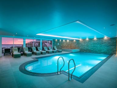 A spa area with indoor pool and loungers at Abalone in St Ives
