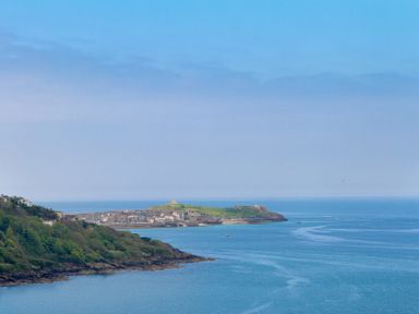 A coastal landscape with a village near the shore and green hills at Atlantic Watch 8 in Carbis Bay