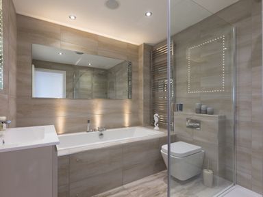 A bathroom with a bathtub sink toilet and shower at Atlantic Watch 8 in Carbis Bay