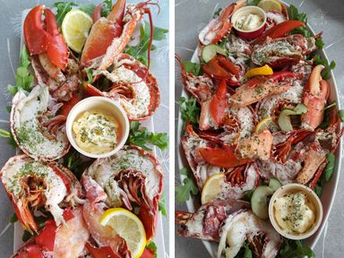 A platter of lobster and crab with lemon wedges and dipping sauce served on a bed of greens at Seagull Lodge in Runswick Bay
