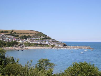 A coastal village with houses and boats in the water at The Potting Shed in New Quay