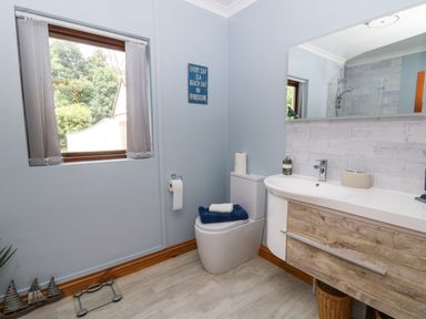 A bathroom with a sink and toilet at Kala in Spittal near Haverfordwest