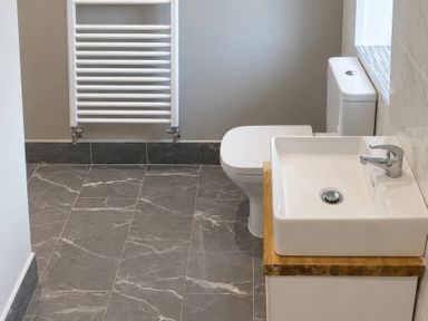 A bathroom with a sink and toilet at Tyddyn Elidir near Old Colwyn
