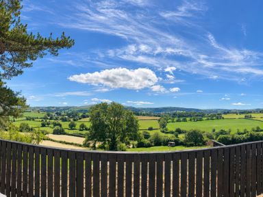 A landscape view with greenery and hills at Tyddyn Elidir near Old Colwyn