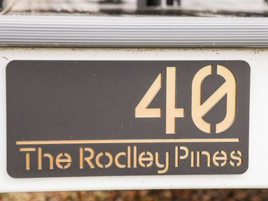 A sign displaying the number 40 and the text The Rodley Pines