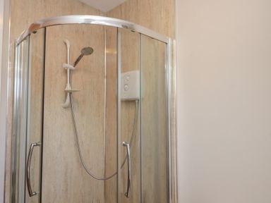 A shower with glass doors and a control panel at Beck View