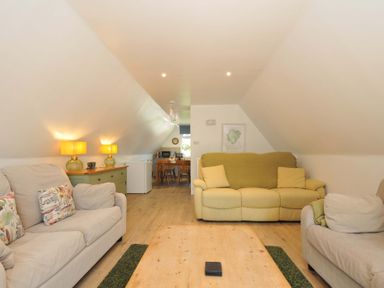 A living room with sofas and a wooden coffee table at 60 Valley Lodge in Callington near Gunnislake