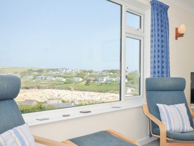 A living room with a view of the beach at Zapadiah in Polzeath