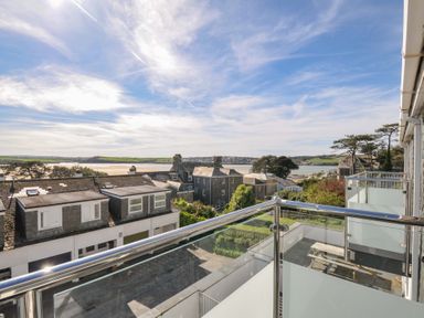 A view from a balcony overlooking buildings and water at Slipway 15 in Rock
