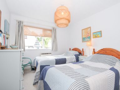 A bedroom with two beds and a window at Rocklings in Rock