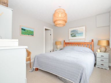 A bedroom with a bed and nightstands at Rocklings, Rock