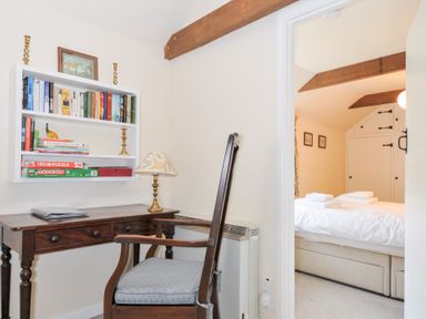 A study room with a desk and bookshelf at Mill Pond in Rock