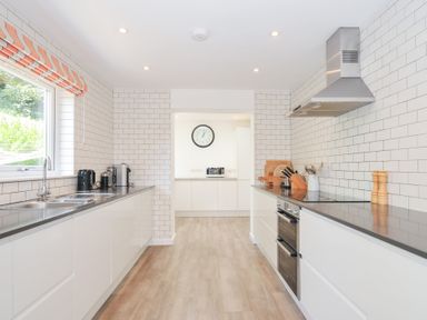 A kitchen with a sink and appliances at Porthilly Brook in Rock