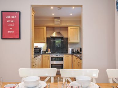 A kitchen with cabinets and appliances at Lowenna Manor 10 Rock