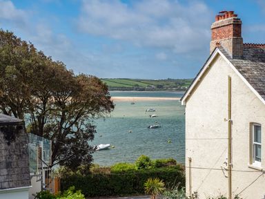 A coastal view with boats on water trees and houses at Slipway 12 in Rock