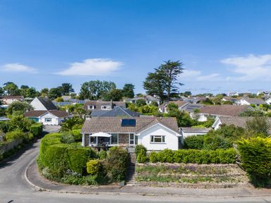 A residential neighborhood with houses surrounded by greenery and roads at Tremay in Rock