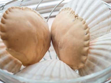 A close up of several seashells in a glass bowl at Cloam Cottage in Port Isaac